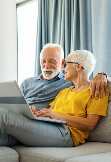 Couple on couch with laptop