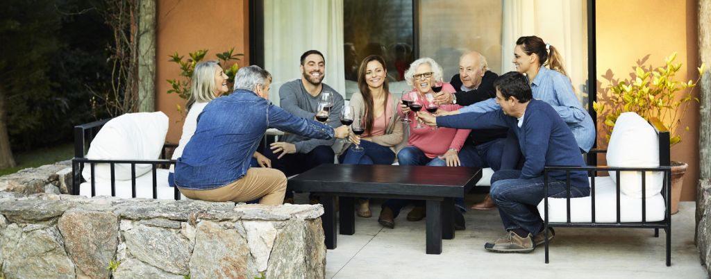 Group on patio with wine - header